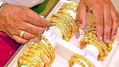 Gold sparkles in stormy week for markets