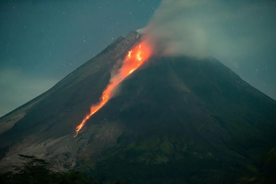 Volcano erupts in eastern Indonesia, spews miles-high ash tower