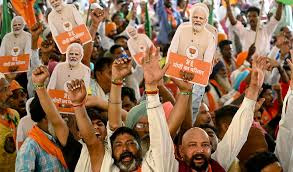 India’s Modi eyes election victory, top opponent back behind bars