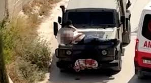 Israeli forces tie wounded Palestinian to jeep in West Bank raid