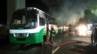 Two buses torched in Press Club area